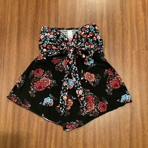 No Boundaries black strapless top with multicolored floral pattern
